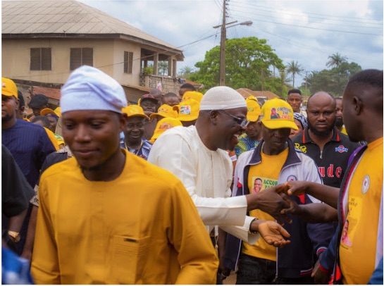 Kayode Hamzat greeting supporters during a ward walkabout