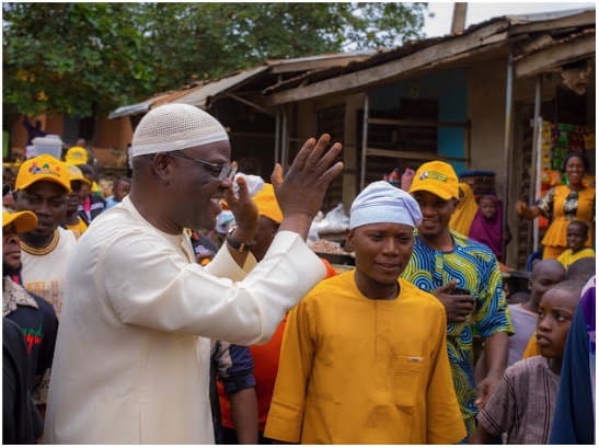 Kayode Hamzat greeting traders during a market walkabout